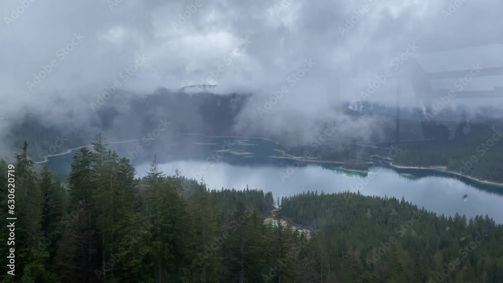 View of Lake Eibsee from the cable car as it travels towards Zugspitze View of Lake Eibsee from the cable car as it travels towards Zugspitze