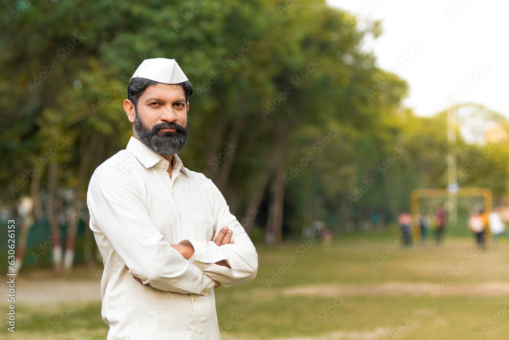 Indian or marathi man in traditional wear and giving expression at park. Indian or marathi man in traditional wear and giving expression at park.