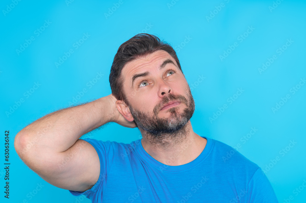 Portrait of thinking man with confused puzzled face on studio isolated background. Man thinking, pensive expression, thoughtful face. Doubt concept. Serious expression, doubting and choice. Portrait of thinking man with confused puzzled face on studio isolated background. Man thinking, pensive expression, thoughtful face. Doubt concept. Serious expression, doubting and choice.