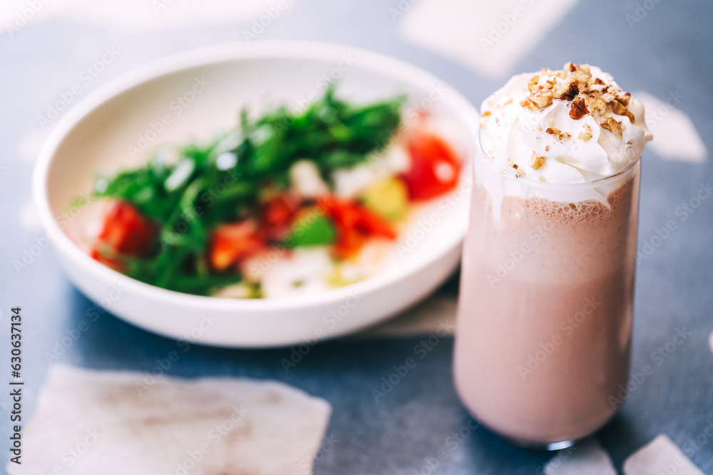 milk drink on a coffee shop flyer. refreshing glaze with ice on the cafe table. summer cold drink with cream milk drink on a coffee shop flyer. refreshing glaze with ice on the cafe table. summer cold drink with cream