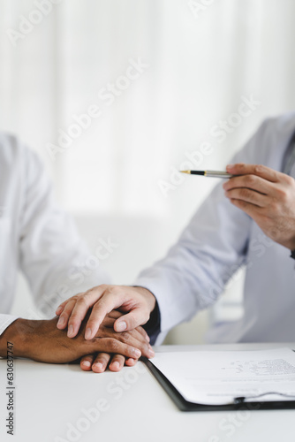 Doctor talking to patient and filling patient history, examination, treatment, medical and health concept..