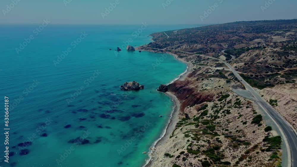 Aerial drone view of a beautiful highway with a coastline overlooking the blue ocean of Cyprus. driving along a beautiful coastal road with cliffs overlooking the blue ocean Aerial drone view of a beautiful highway with a coastline overlooking the blue ocean of Cyprus. driving along a beautiful coastal road with cliffs overlooking the blue ocean