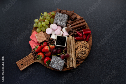 Bilde på lerret Selection of sweets and fruits on a platter