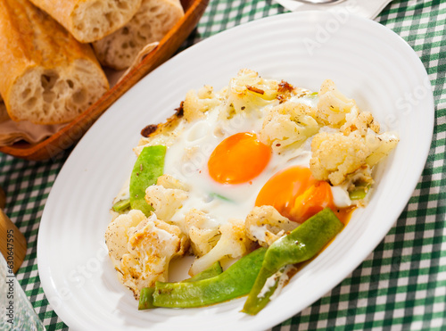 Appetizing cauliflower fried eggs for breakfast. High quality photo