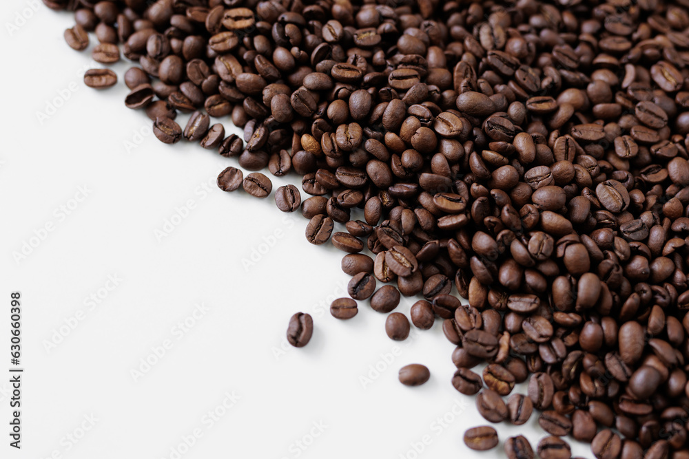 Roasted black coffee beans on white background