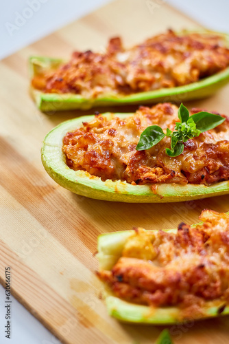 Stuffed zucchini on white background, baked loaded zucchini boats, Top view, Homemade.