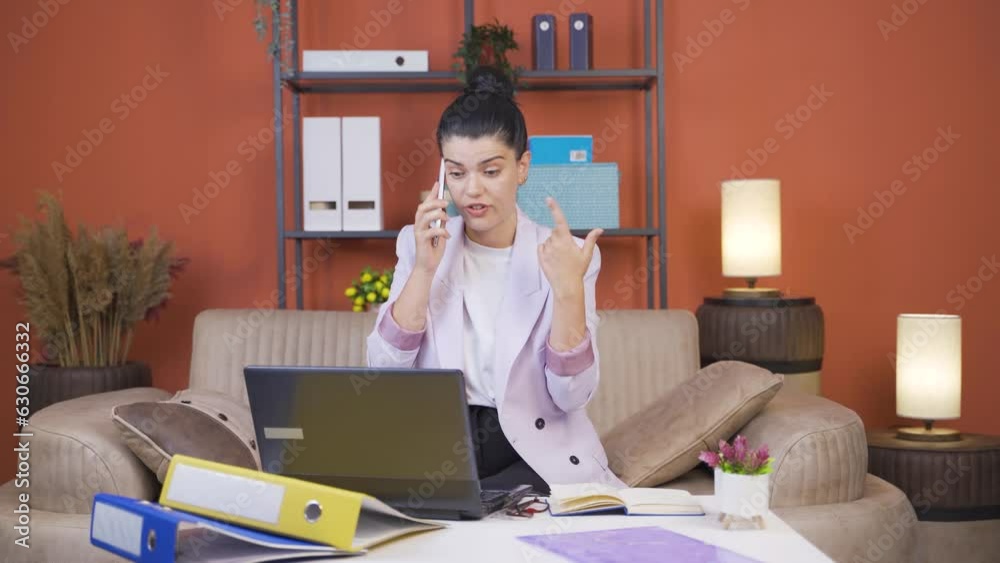 Home office worker young woman speaks on the phone in young womanagerial qualifications. Home office worker young woman speaks on the phone in young womanagerial qualifications.