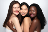 Three joyful multiethnic women hugging, smiling, isolated on white.