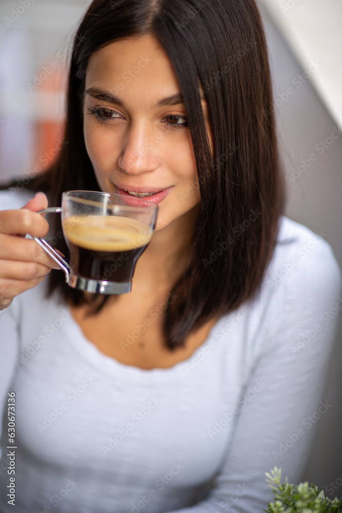 Close up young woman drinking cup of coffee Close up young woman drinking cup of coffee