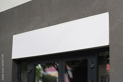 Картината върху платно Blank white shop sign mockup, large billboard banner on a storefront mock up template