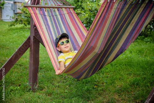 Cute little Caucasian boy relaxing and having fun in multicolore