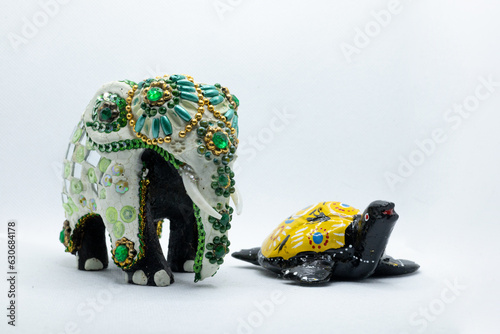 Photography colorful handcrafted wooden elephant and wooden turtle isolated on white backgro