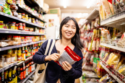Wallpaper Mural 20-something Asian woman shopping buying groceries at a supermarket Torontodigital.ca