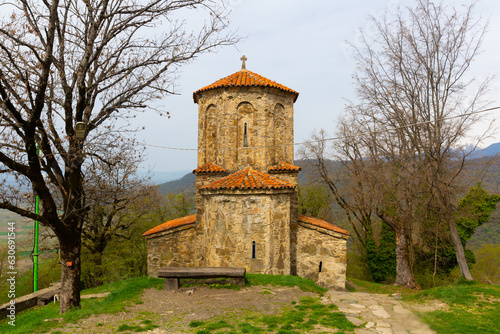Spring landscape with ancient Orthodox Church of Archangel built of rubble on territory of Nekresi monastery on Nazvrevi Gora, Qvareli Municipality, Georgia.. photo