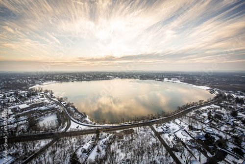 Aerial view of Lake Ronkonkoma with snow at sunset in Long Island, New York, USA