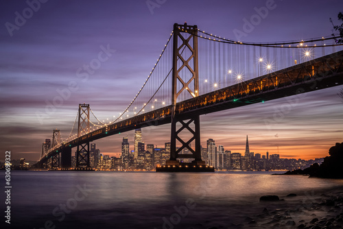 San Francisco-Oakland Bay Bridge and city skyline at sunset in California  USA
