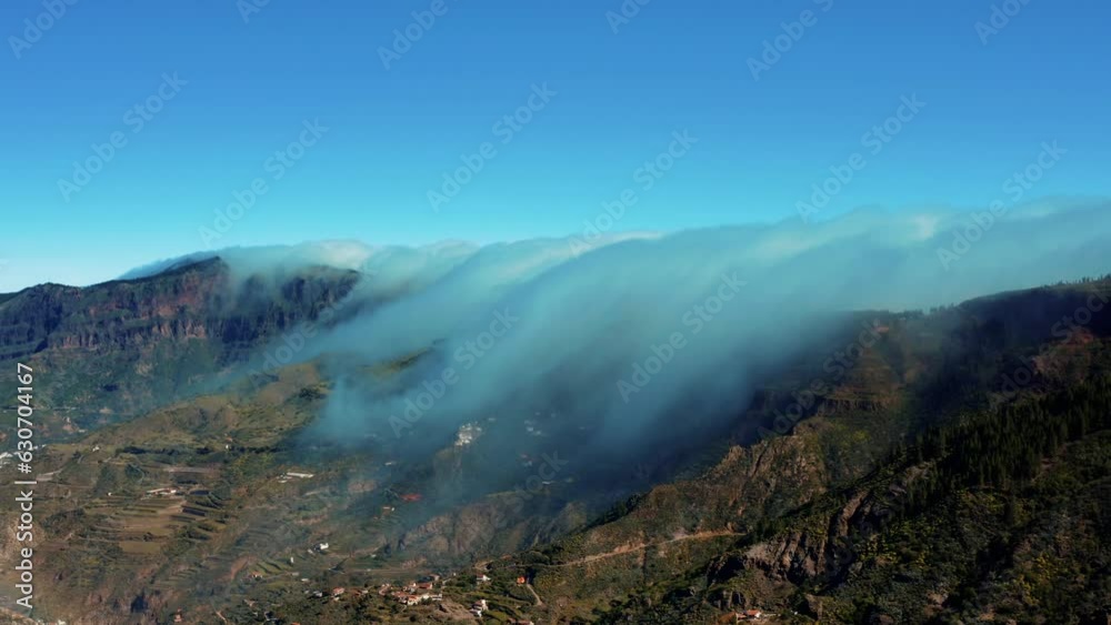 Drone timelapse of clouds passing above the edge of a mountain - Gran Canaria Drone timelapse of clouds passing above the edge of a mountain - Gran Canaria