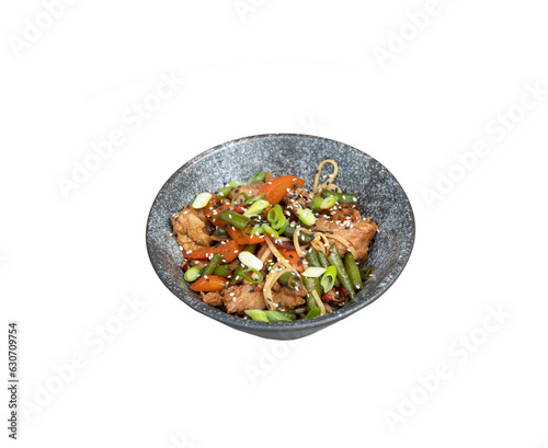 A bowl of udon noodles, veal and fried vegetables angle view on transparent background