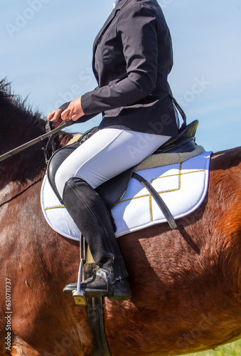 Close-up of a rider on a horse in a dressage competition