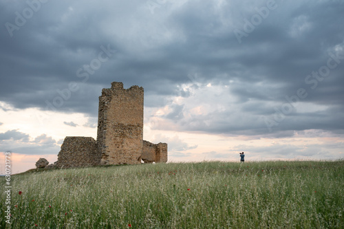 The Lone Explorer: A Peaceful Moment at an Ancient Fortress