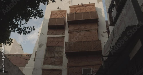 Old houses with wooden mashrabiya in al-Balad quarterJeddah  Saudi Arabia photo