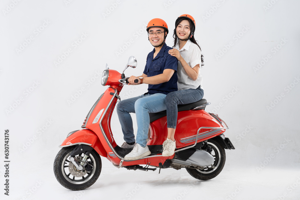 image of asian couple riding scooter on white background image of asian couple riding scooter on white background