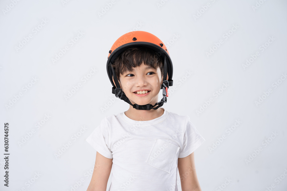 portrait of asian boy wearing orange helmet on white background portrait of asian boy wearing orange helmet on white background