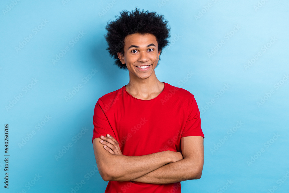 Photo portrait of nice cool funny multinational exchange student guy crossing hands confident isolated blue color background Photo portrait of nice cool funny multinational exchange student guy crossing hands confident isolated blue color background