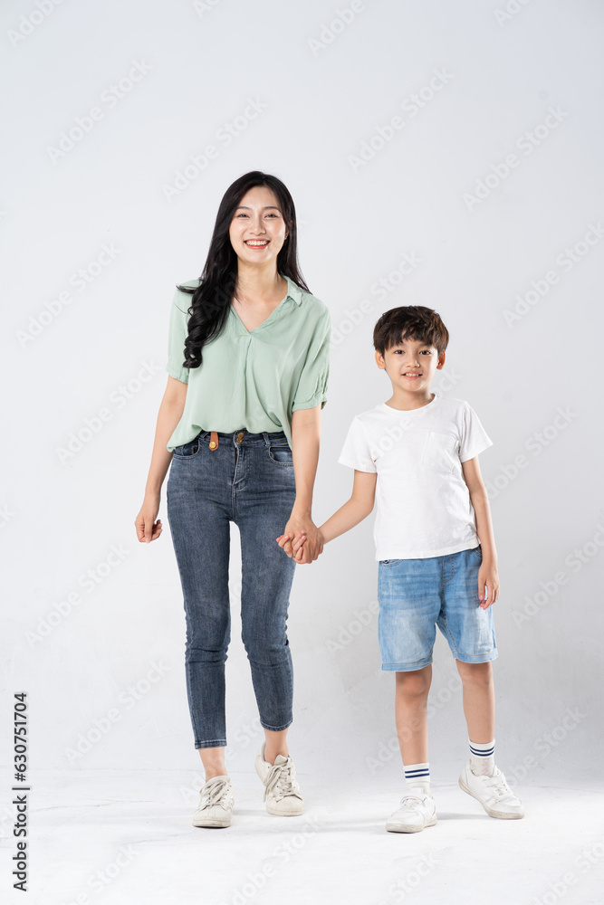 mother and son posing on a white background mother and son posing on a white background