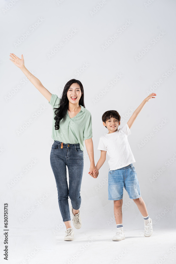 mother and son posing on a white background mother and son posing on a white background