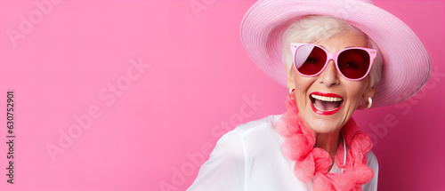 Old happy woman with pink dress and sunglasses on pink background ai generated