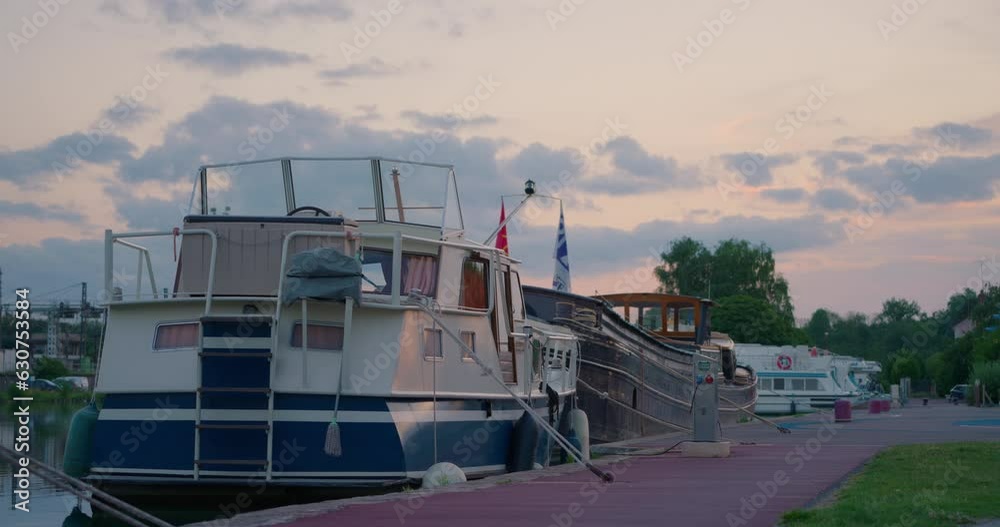 Ships, yachts and other watercraft stand on the pier on the water channel in the French city Ships, yachts and other watercraft stand on the pier on the water channel in the French city