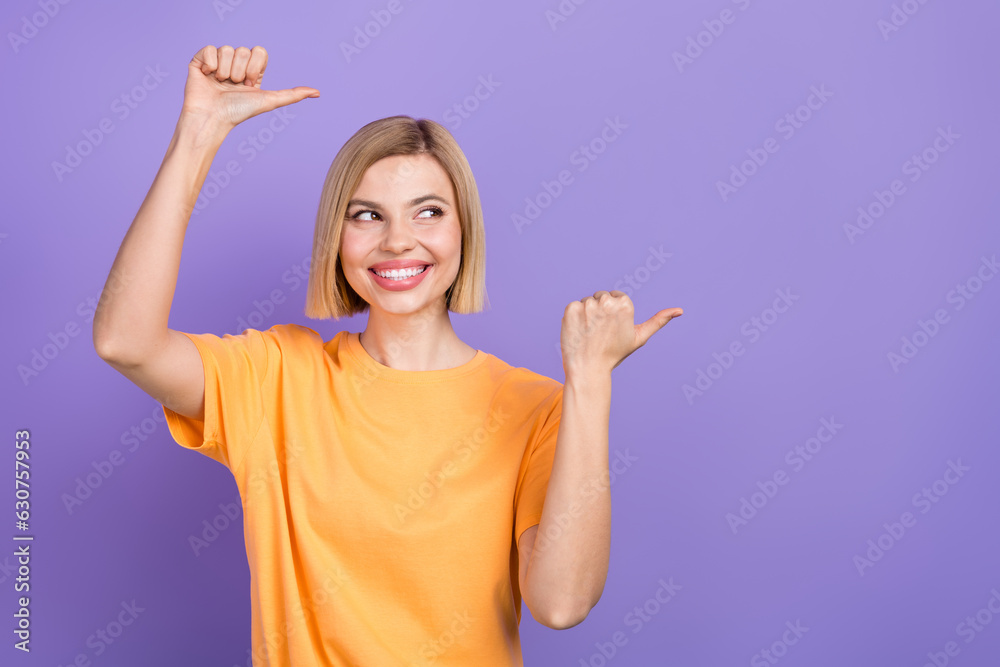 Portrait of young pretty girl adv promoter indicate thumb fingers show empty space mockup isolated purple color background Portrait of young pretty girl adv promoter indicate thumb fingers show empty space mockup isolated purple color background