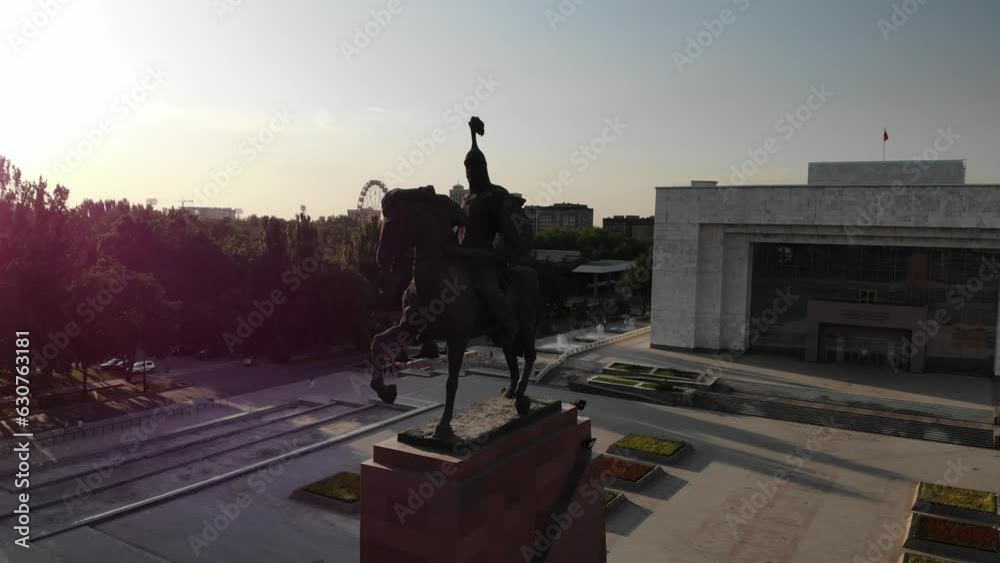 Monument to Manas the Great Bishkek Kyrgystan. Sunset Aerial drone view. Flying over. Drone is rotating right flying around. High quality 4k footage Monument to Manas the Great Bishkek Kyrgystan. Sunset Aerial drone view. Flying over. Drone is rotating right flying around. High quality 4k footage