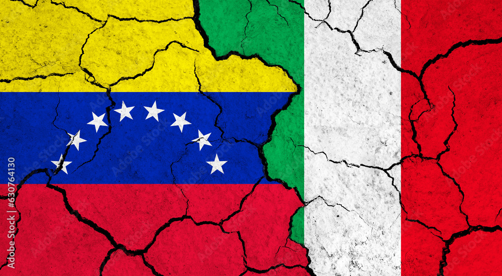 Flags of Venezuela and Italy on cracked surface - politics, relationship concept