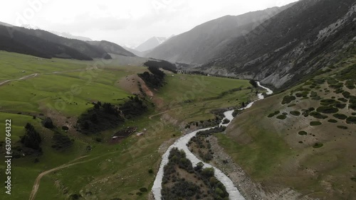 Semenovskoye Grigorevskoye Canyon mountains and green valley Kyrgystan near Issyk Kul. Aerial drone view. Flying over. High quality photo photo