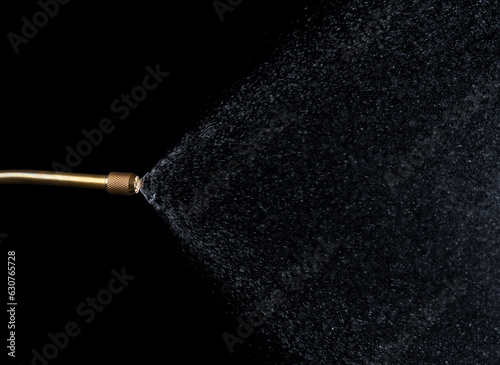 Spray jet water pressure nozzle isolated on black background