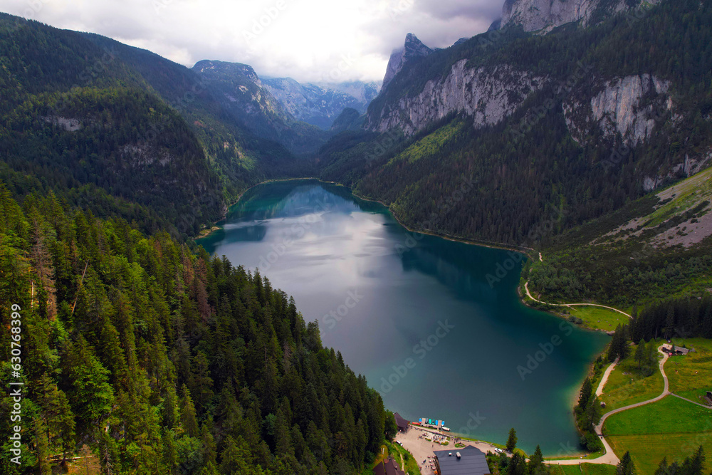 Drone photo of Lake Gosau a picturesque alpine gem nestled in Austria's Dachstein region. With its turquoise waters reflecting the surrounding majestic peaks
