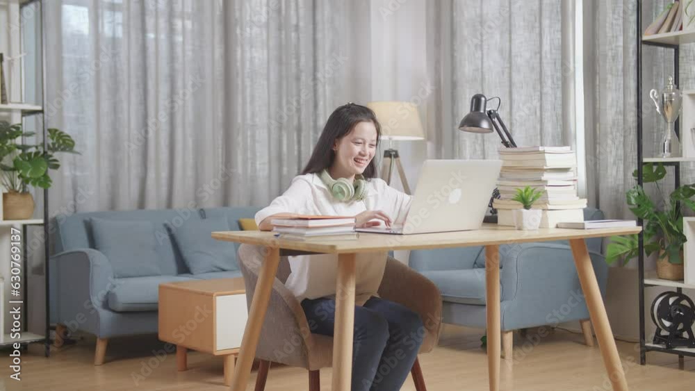 Asian Teenager Student Celebrating With Laptop Computer At Home, Teenage Girl Learning Online From Laptop
Asian Teenager Student Celebrating With Laptop Computer At Home, Teenage Girl Learning Online From Laptop