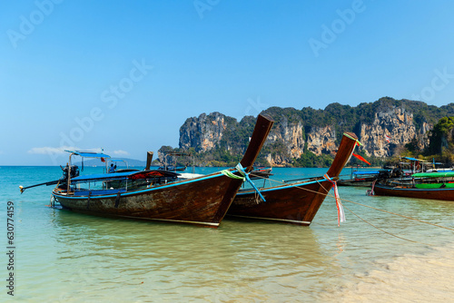 Longtail tourist boats anchored on the beach in Thailand