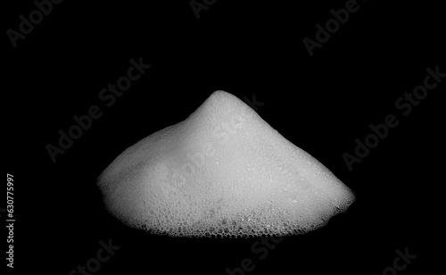 Foam texture, white bubbles from soap or shampoo or shower gel and facial foam. isolated on black background