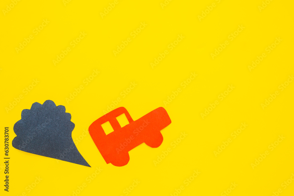 Kids paper car and traffic fumes - CO2 carbone dioxide control concept Kids paper car and traffic fumes - CO2 carbone dioxide control concept