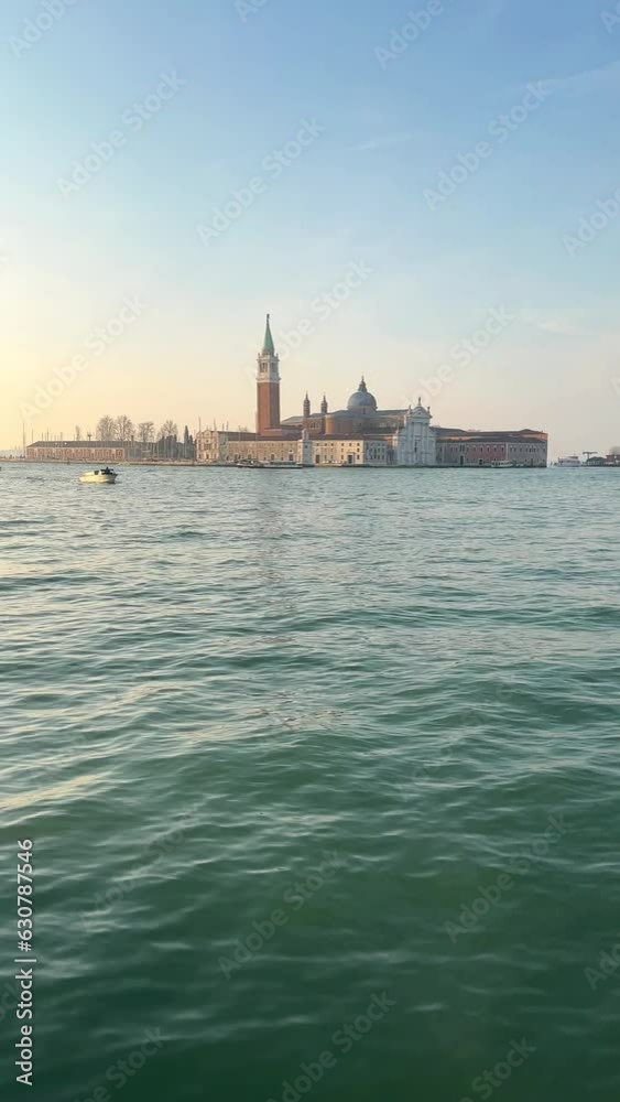 Vertical video of a water channel surrounded by old buildings in Venice, Italy Vertical video of a water channel surrounded by old buildings in Venice, Italy