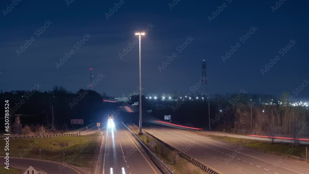 Time-lapse view of cars driving on a highway during a nighttime Time-lapse view of cars driving on a highway during a nighttime