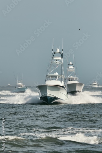 Large fishing vessel is seen navigating through the choppy waters of the open ocean