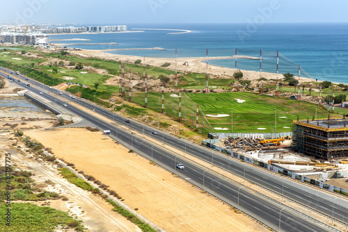 Aerial view of the golf course and road in city Muscat. Sultanate of Oman
