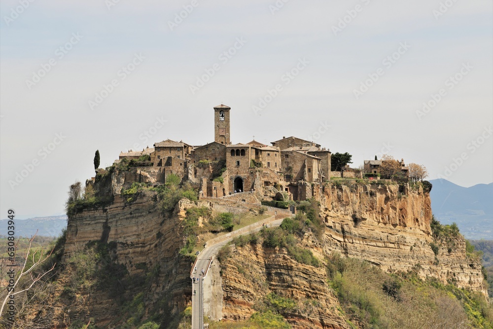 Breathtaking aerial view of the hill town of Bagnoregio, Italy, surrounded by winding roads