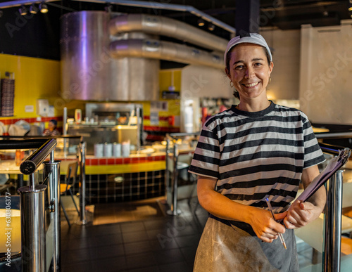 smiling restaurant waitress woman looking at camera, italian food