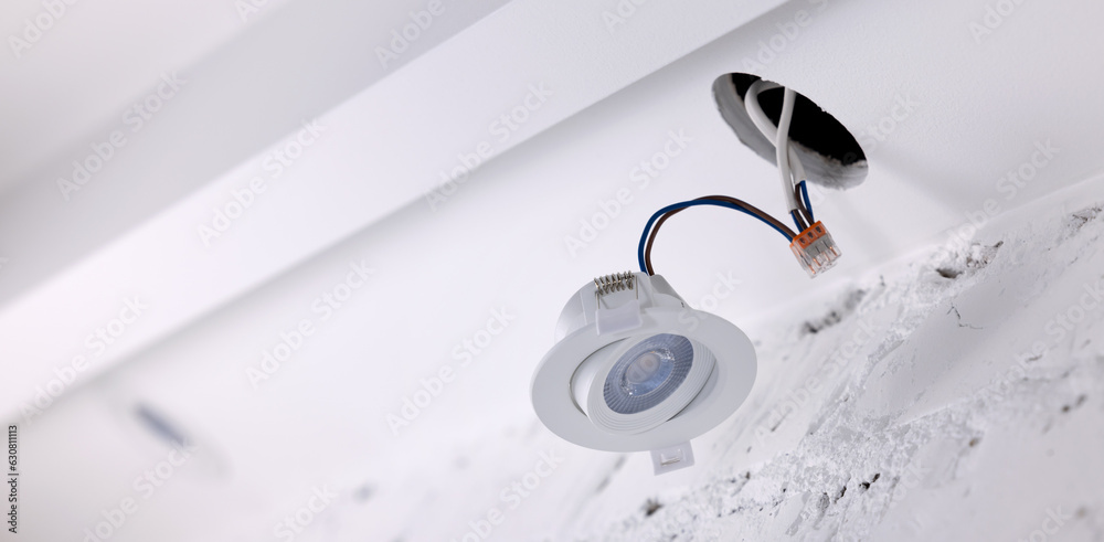 recessed lamp installation in drywall ceiling. led interior lighting. banner with copy space recessed lamp installation in drywall ceiling. led interior lighting. banner with copy space