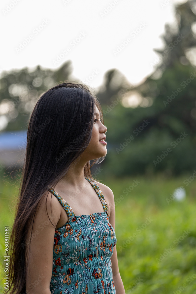 little girl with black long hair in profile little girl with black long hair in profile